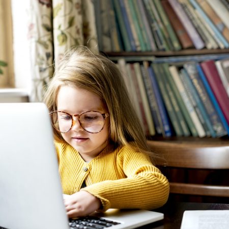 Little Girl Using Digital Laptop E-learning Concept